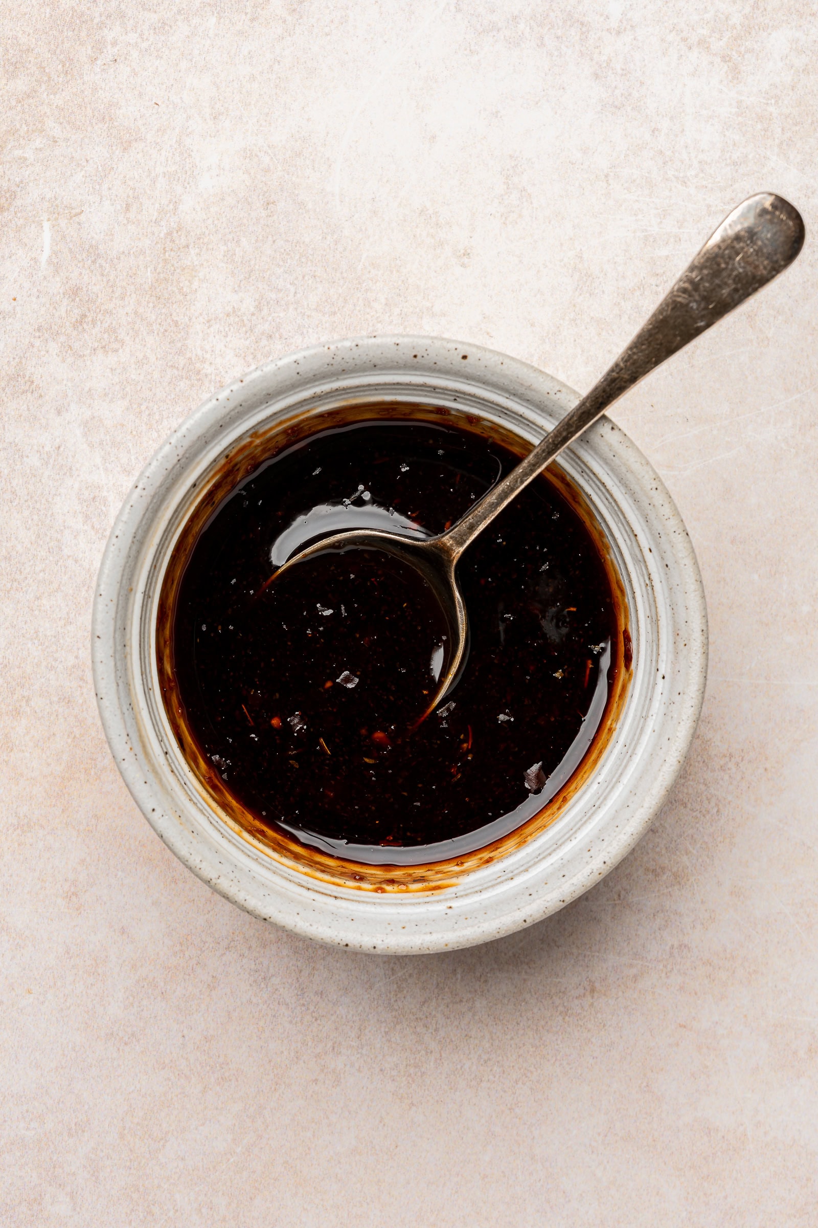 Balsamic glaze in a small bowl.