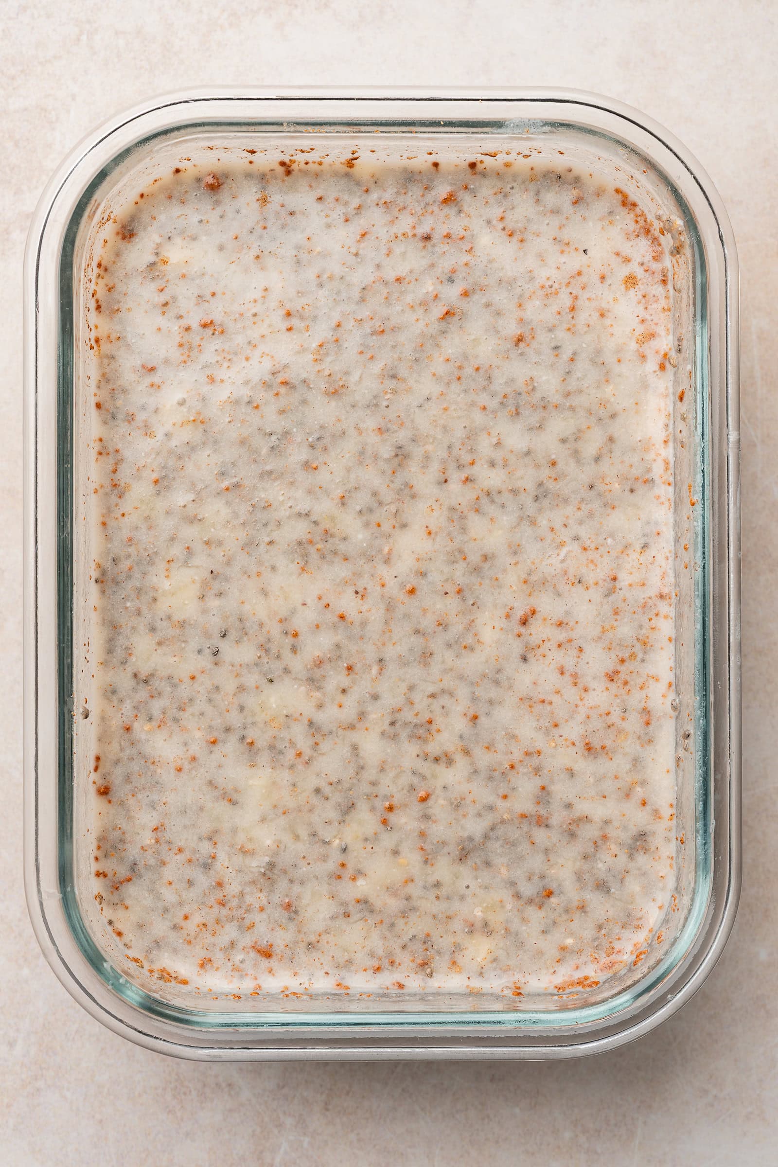 Chia pudding in rectangle container after being mixed.
