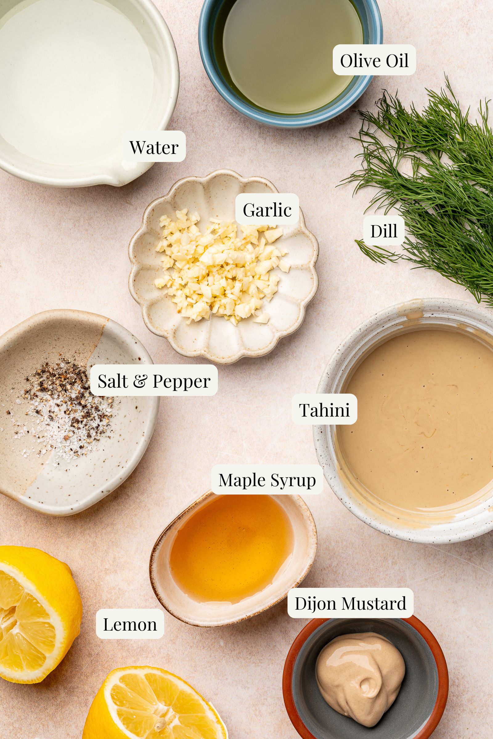 Labeled ingredients for homemade tahini dill dressing.