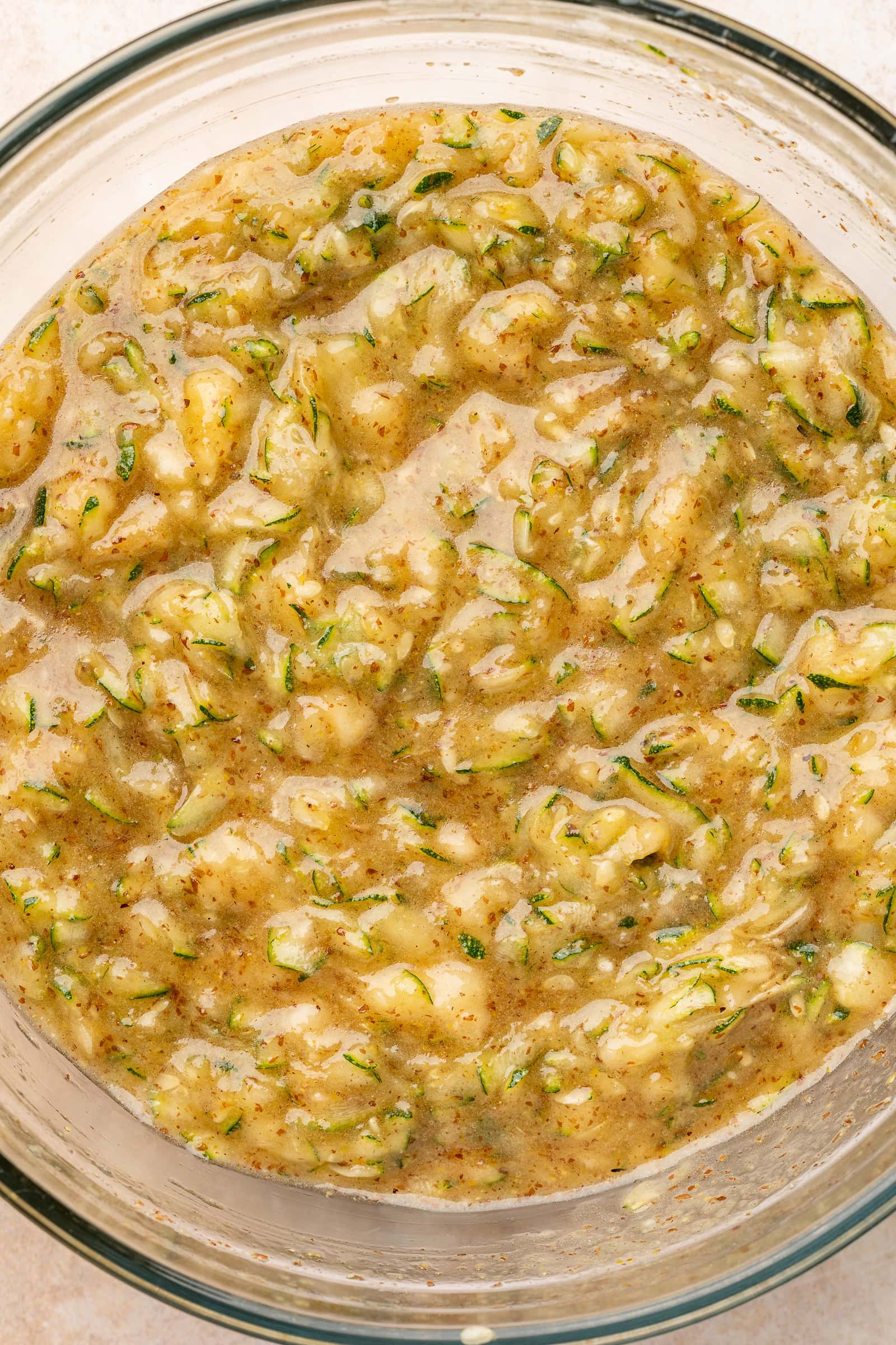 Wet batter in glass bowl.