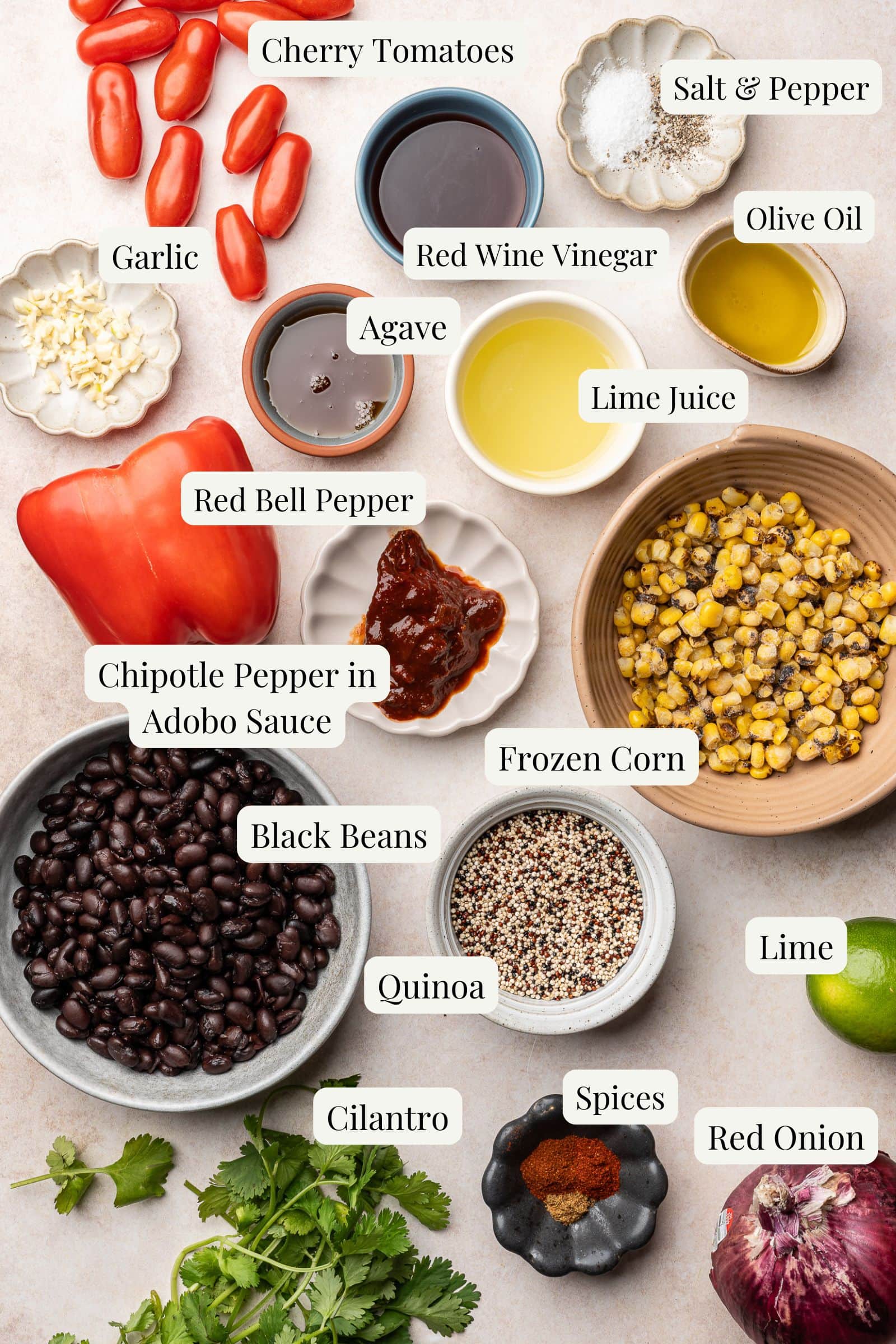 Labeled ingredients for a corn and black bean quinoa salad with chipotle lime vinaigrette.