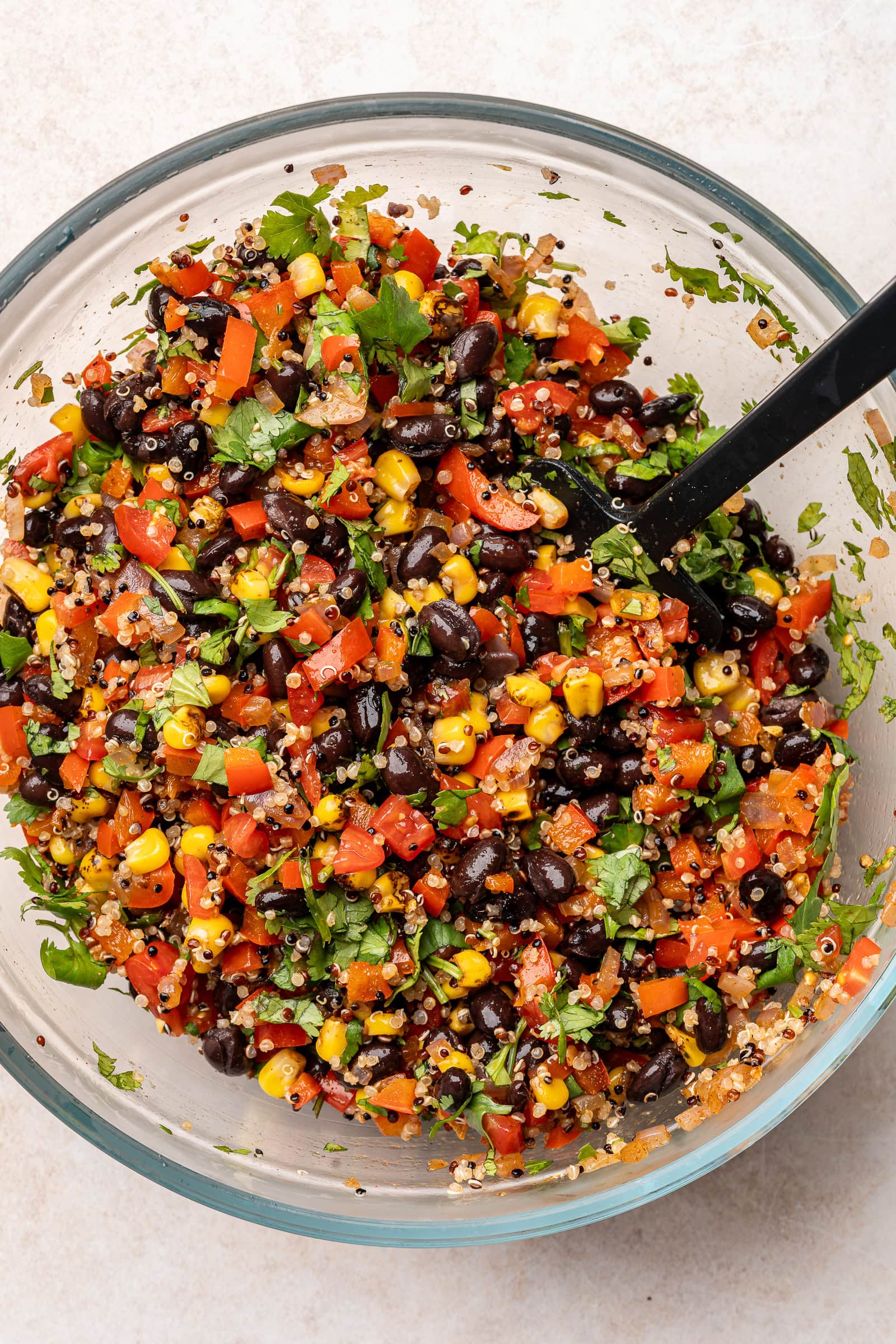Corn quinoa salad mixed together in a large bowl.