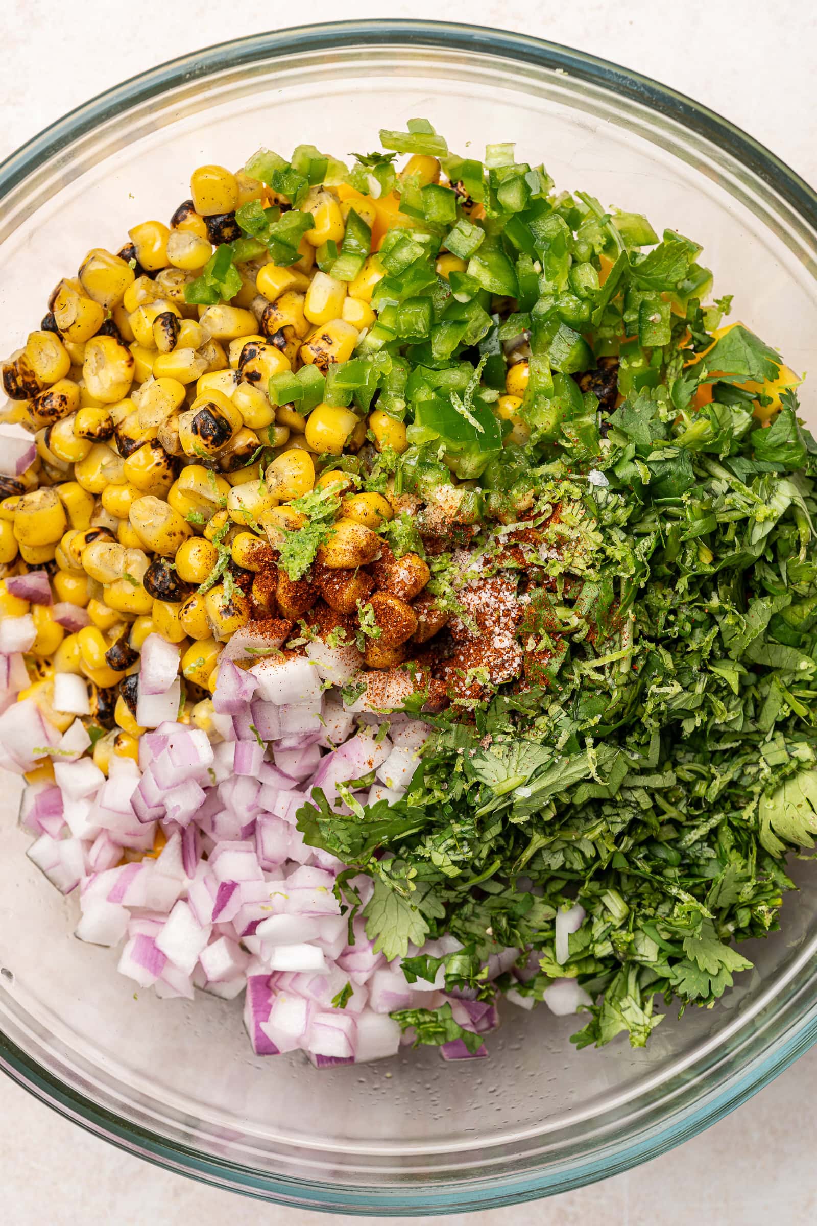 Mango corn salsa ingredients in a large bowl.