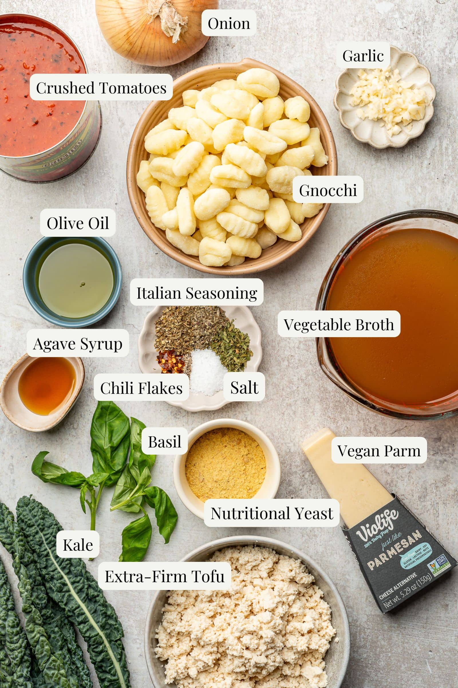 Labeled ingredients to make tomato gnocchi soup.