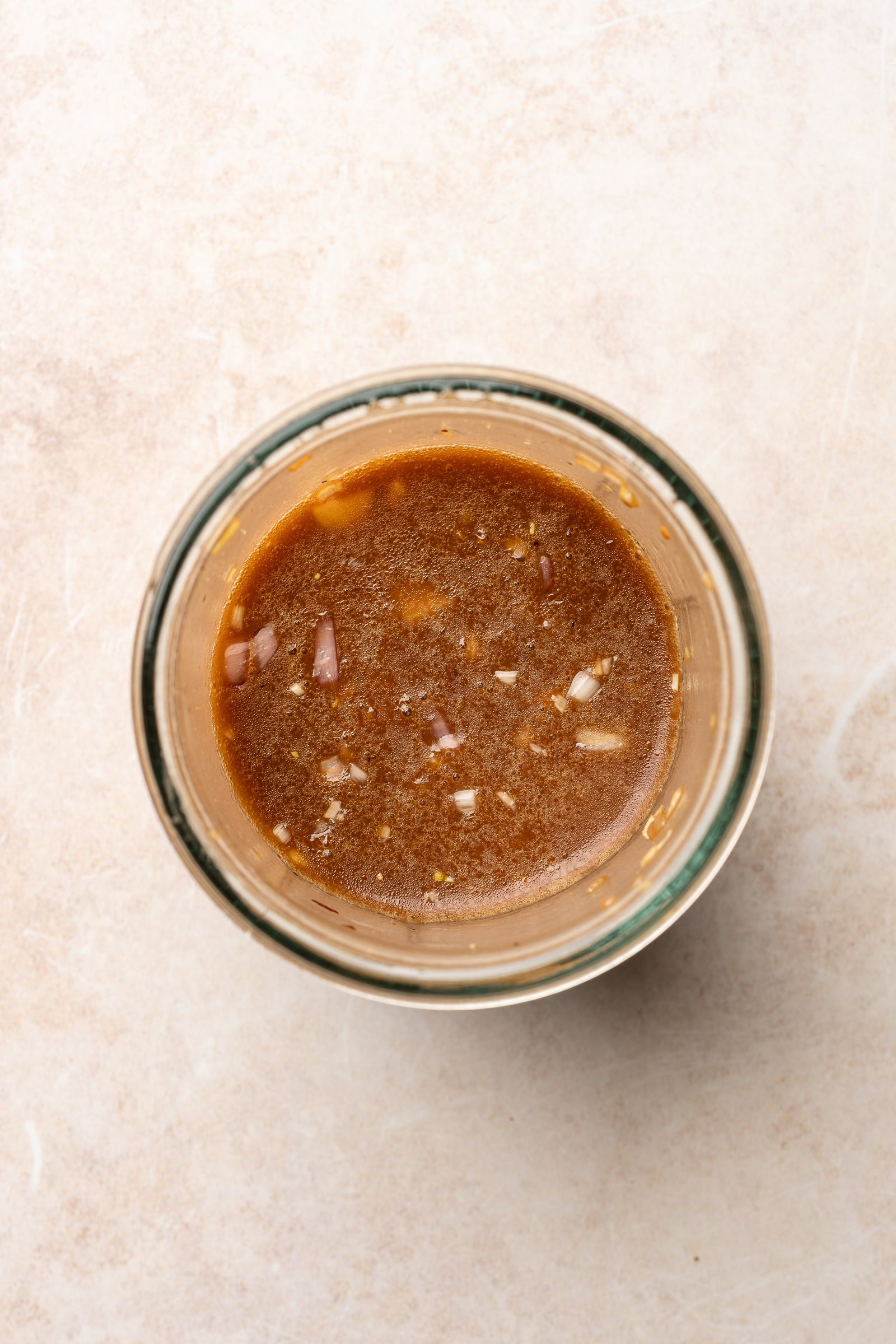 Balsamic maple dressing in a glass jar.