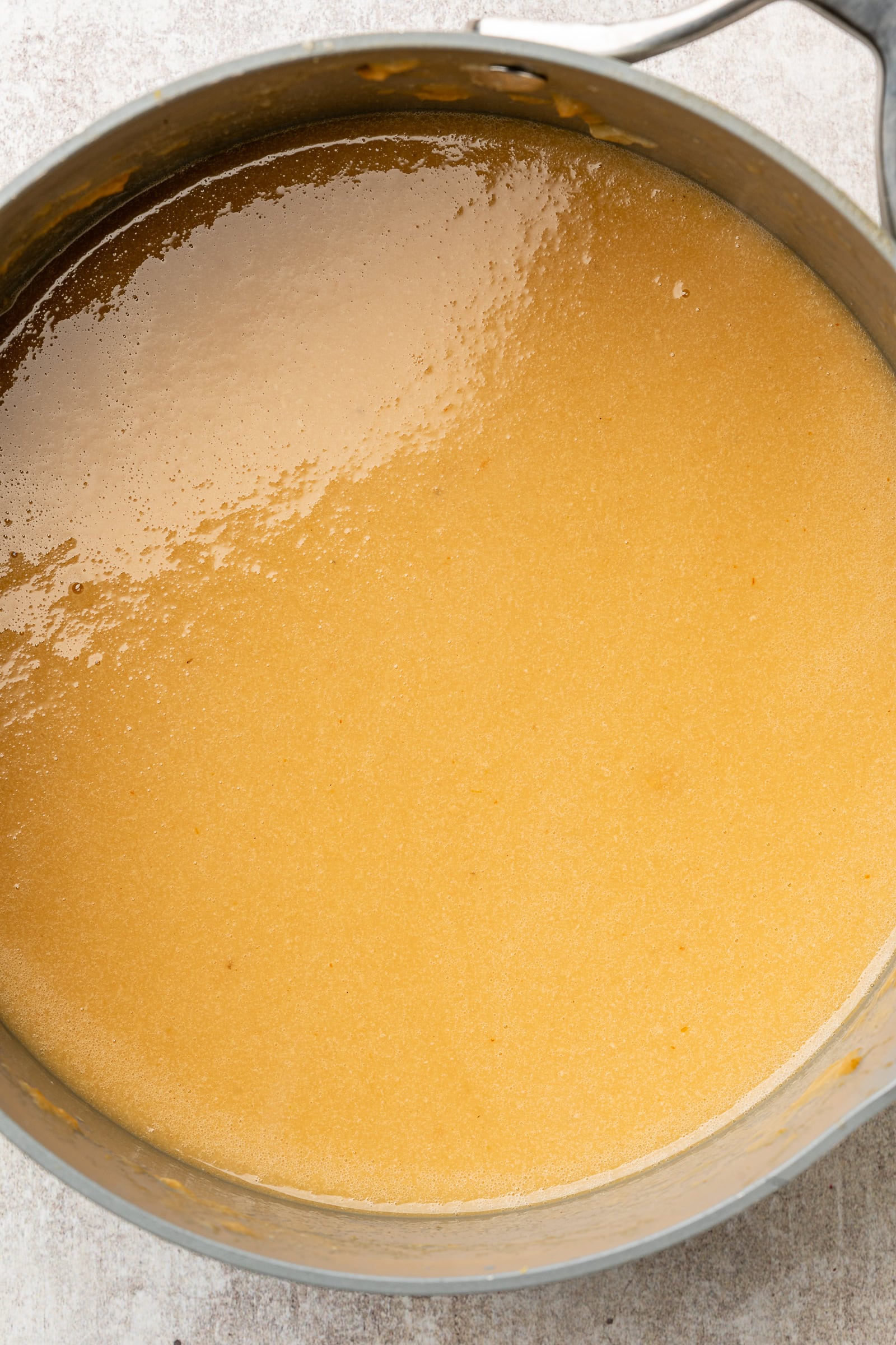 Whole garlic and onion wedges removed from gravy.