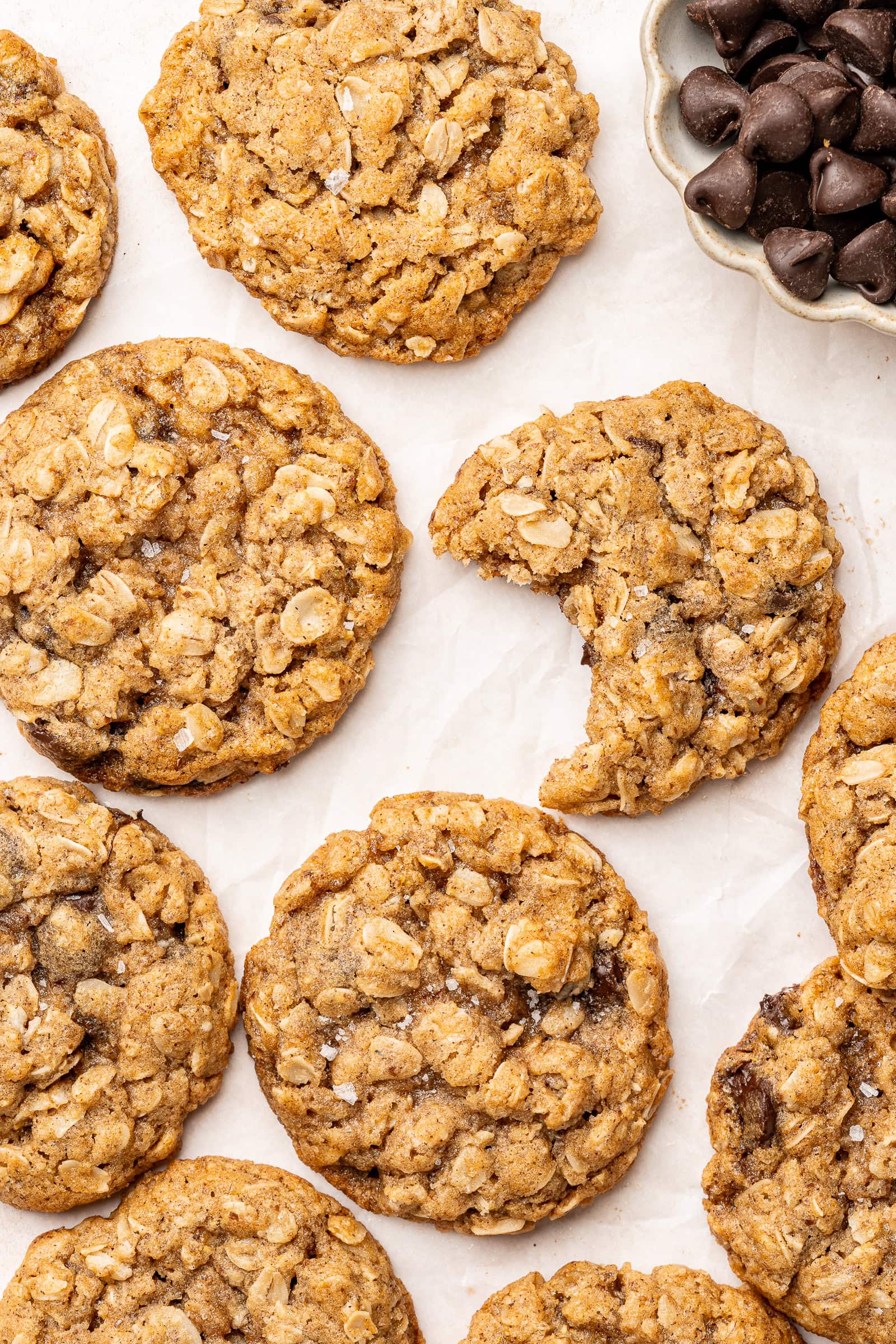 Close up vegan oatmeal chocolate chip cookies with flaky salt.