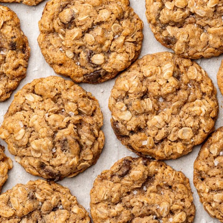 Close up vegan oatmeal chocolate chip cookies with flaky salt.