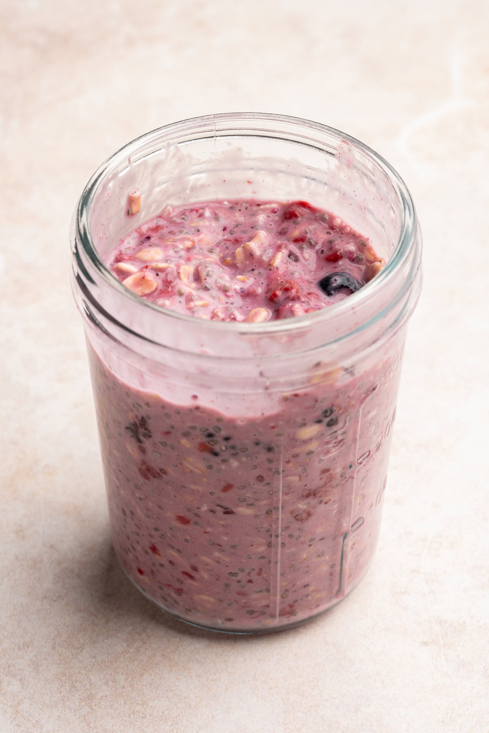 Frozen berries mixed into overnight oats.