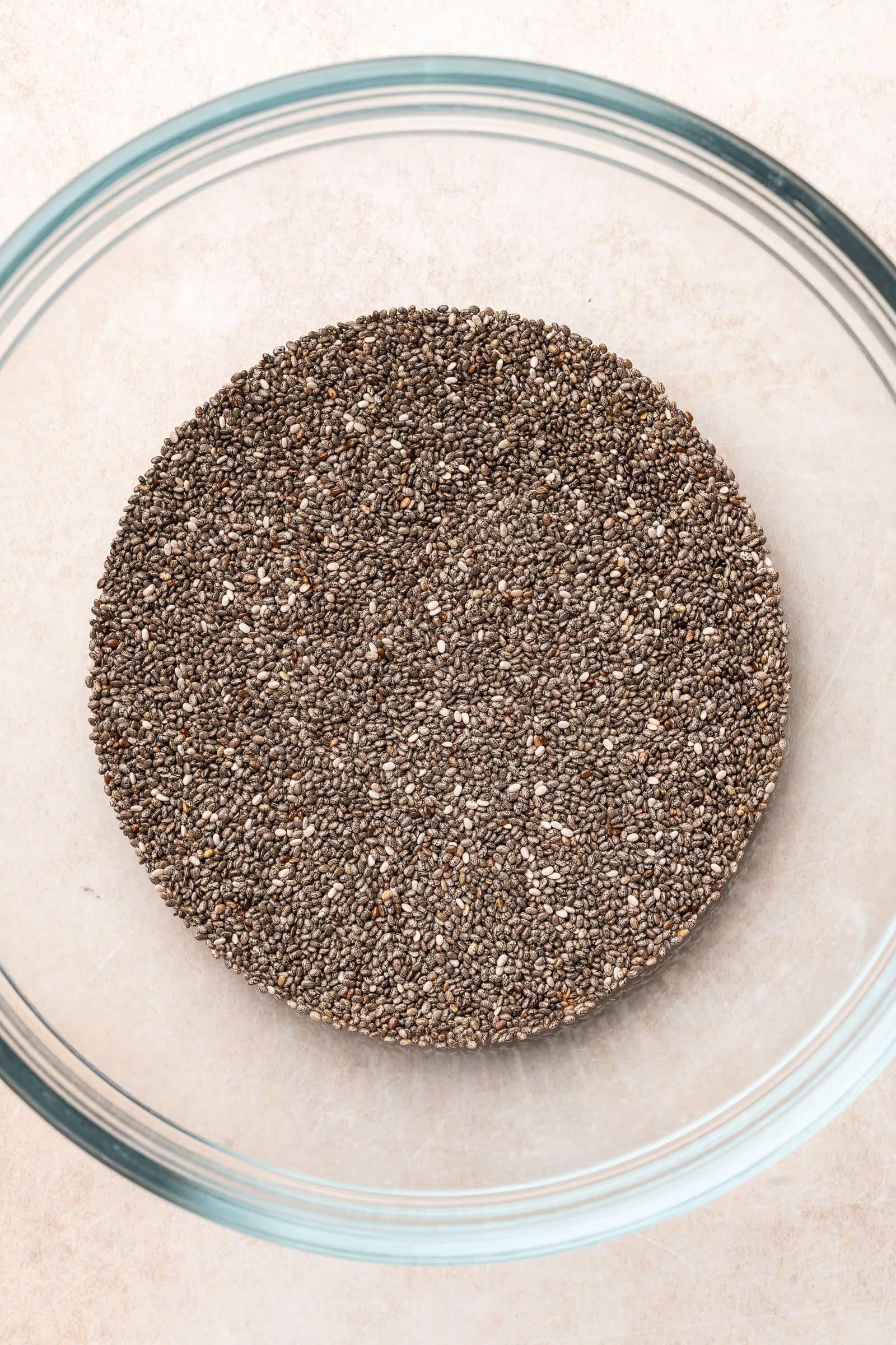 Chia seeds in a glass bowl.