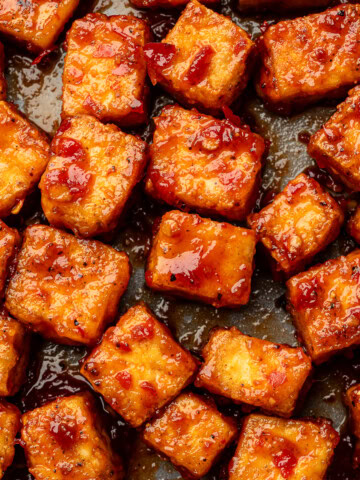 Close up of harissa glazed tofu cubes.