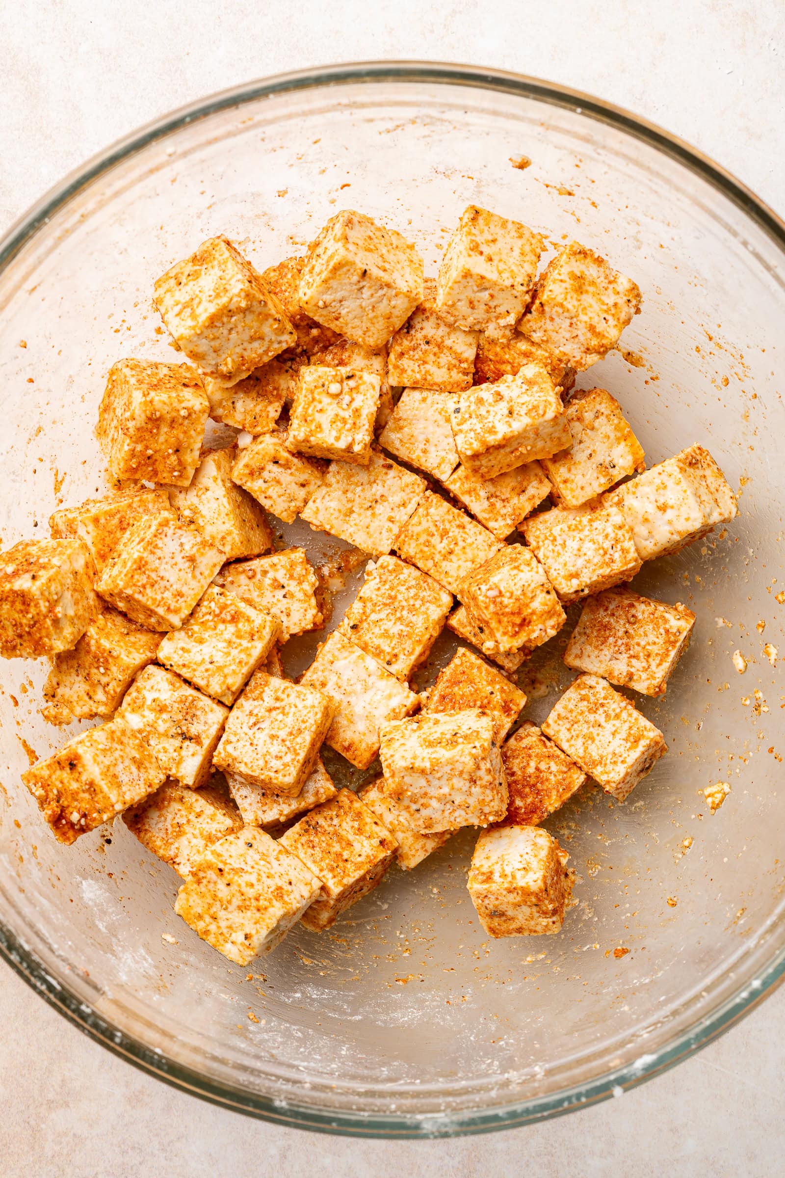 Seasoned tofu in glass bowl.