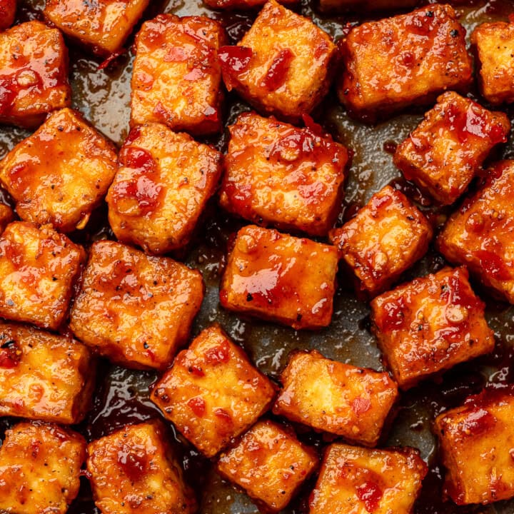 Close up of harissa glazed tofu cubes.