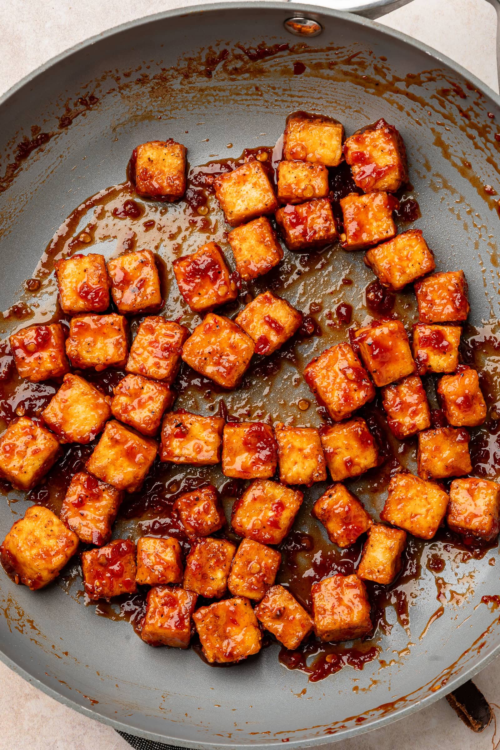 Tofu cubes tossed in harissa glaze.