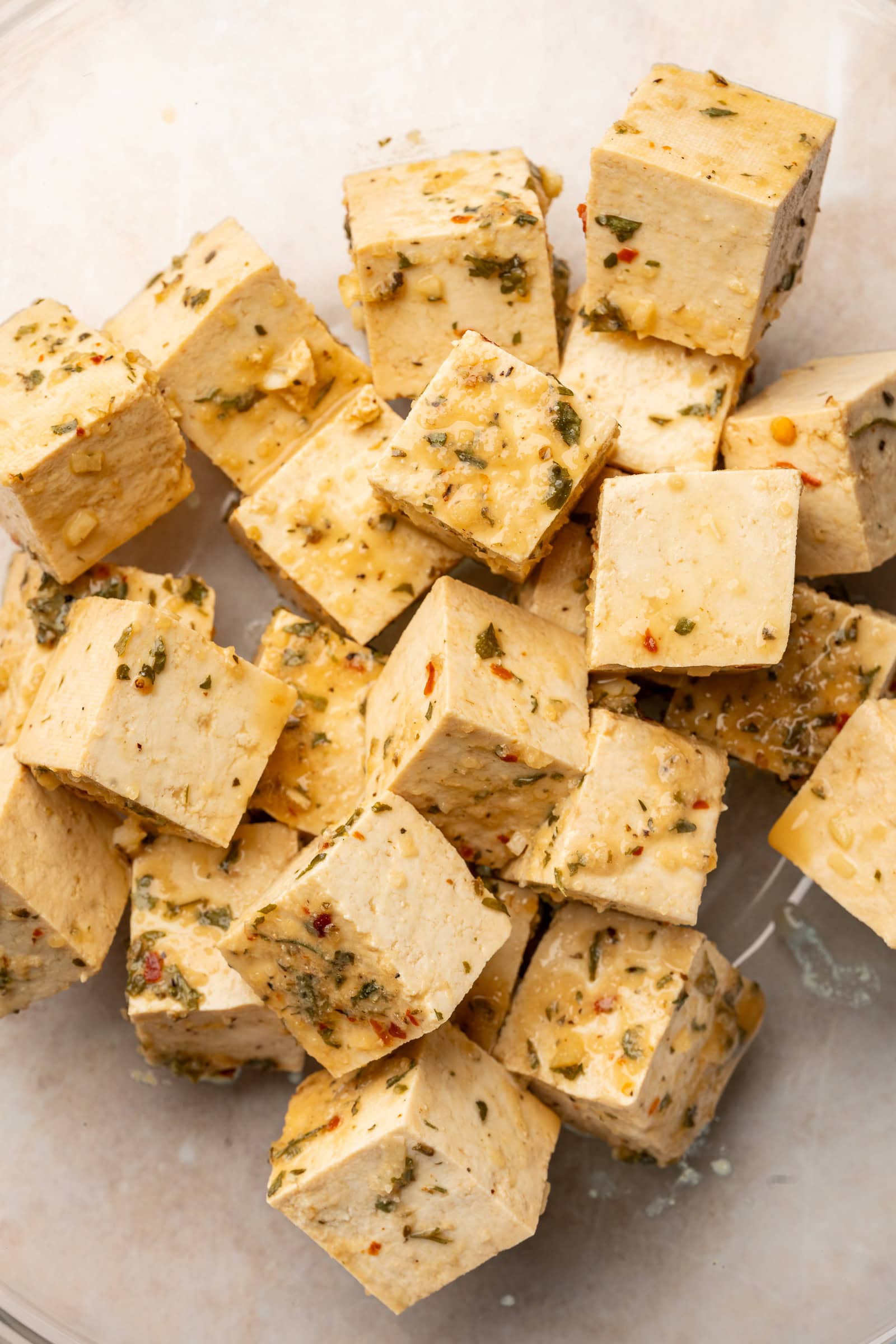 Tofu drained from marinade and placed in glass bowl.