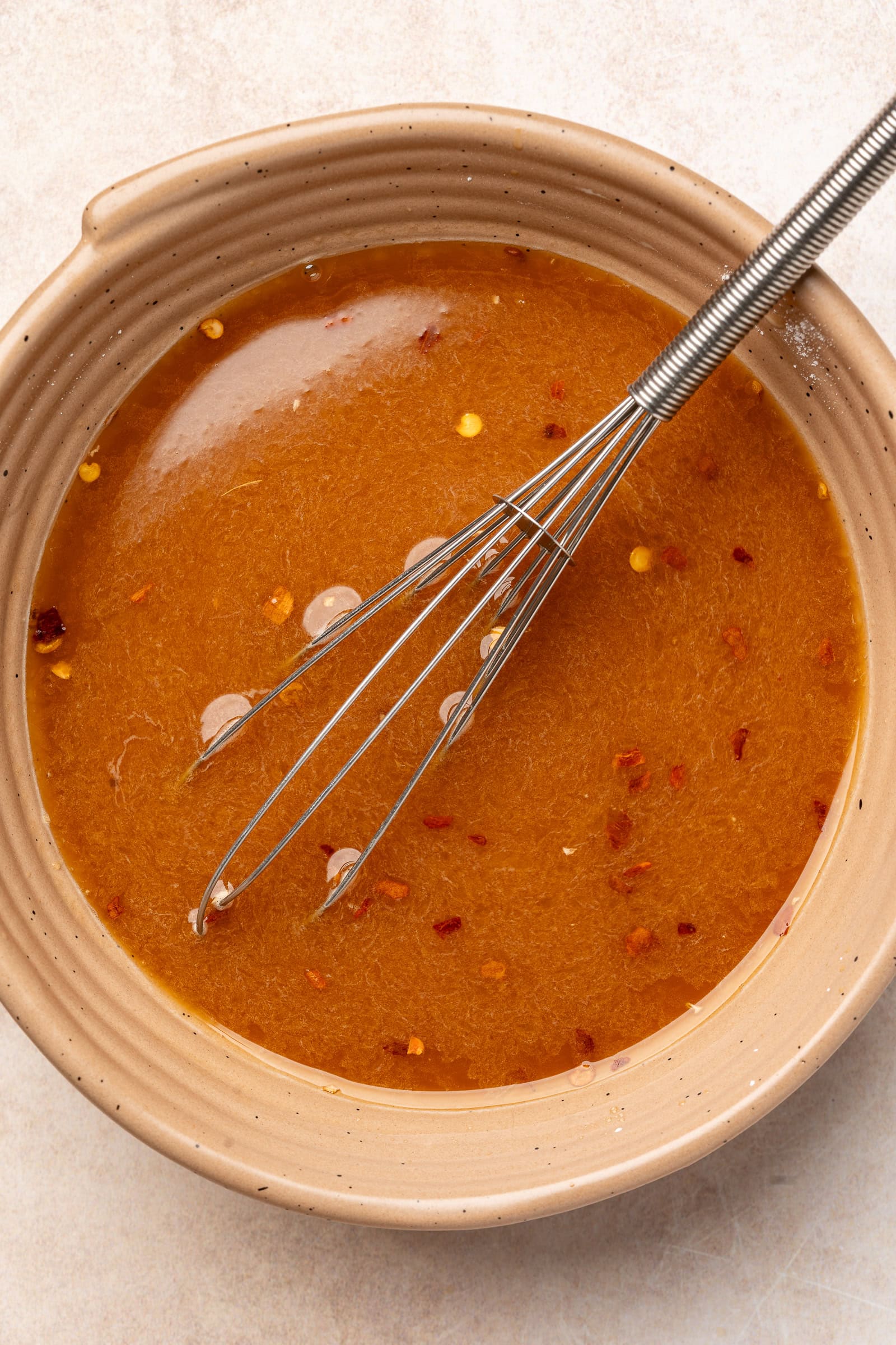 Teriyaki sauce ingredients being mixed in a bowl.