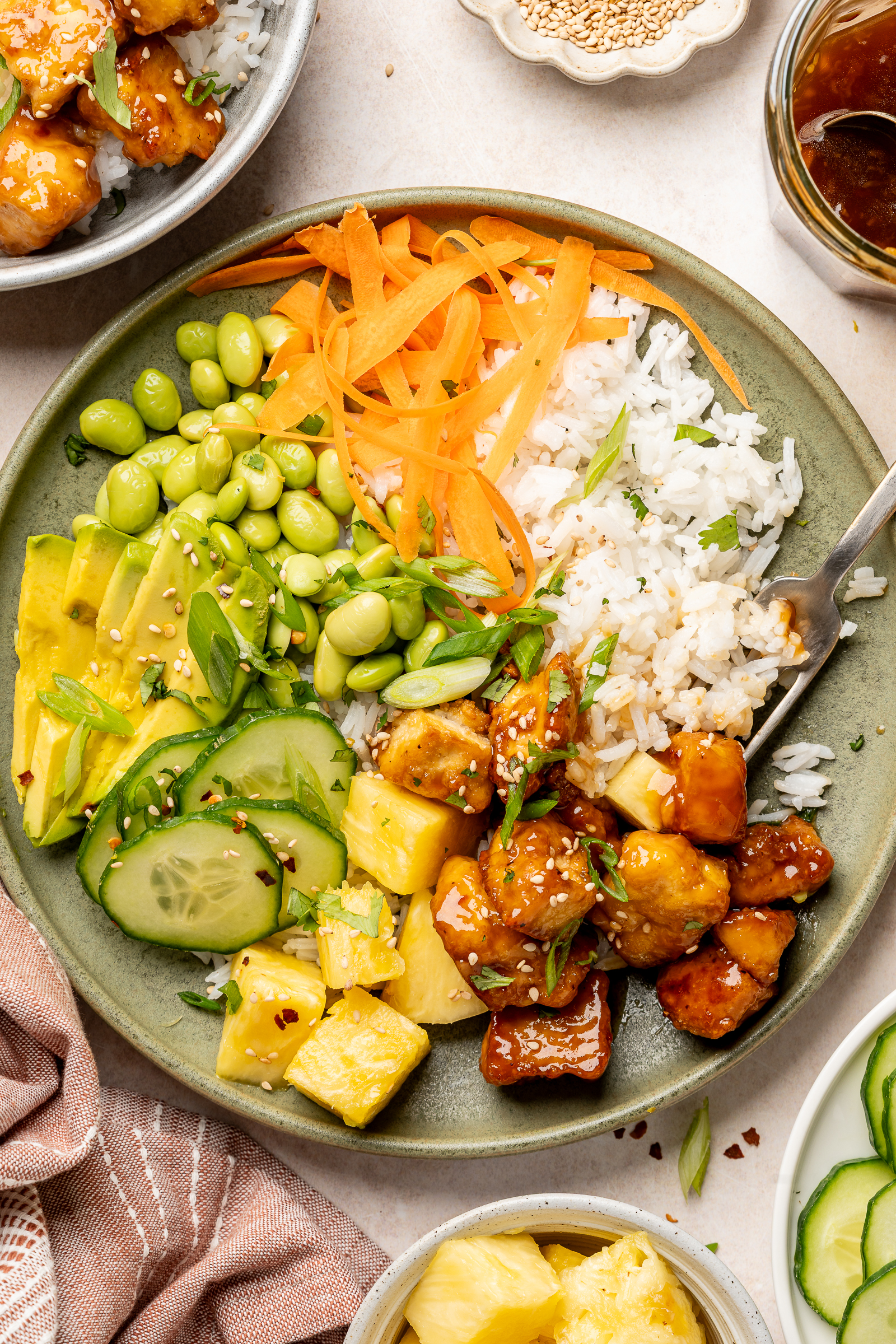 Tofu rice bowl using teriyaki sauce and crispy baked tofu.