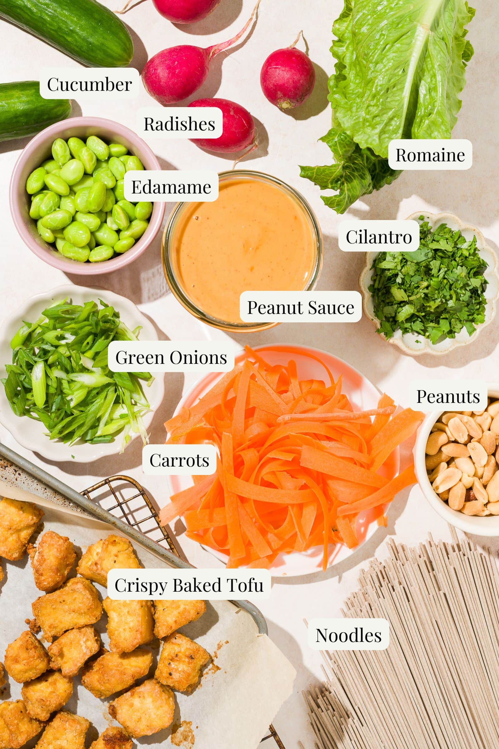 Labeled ingredients for vegan peanut noodle bowl with tofu.
