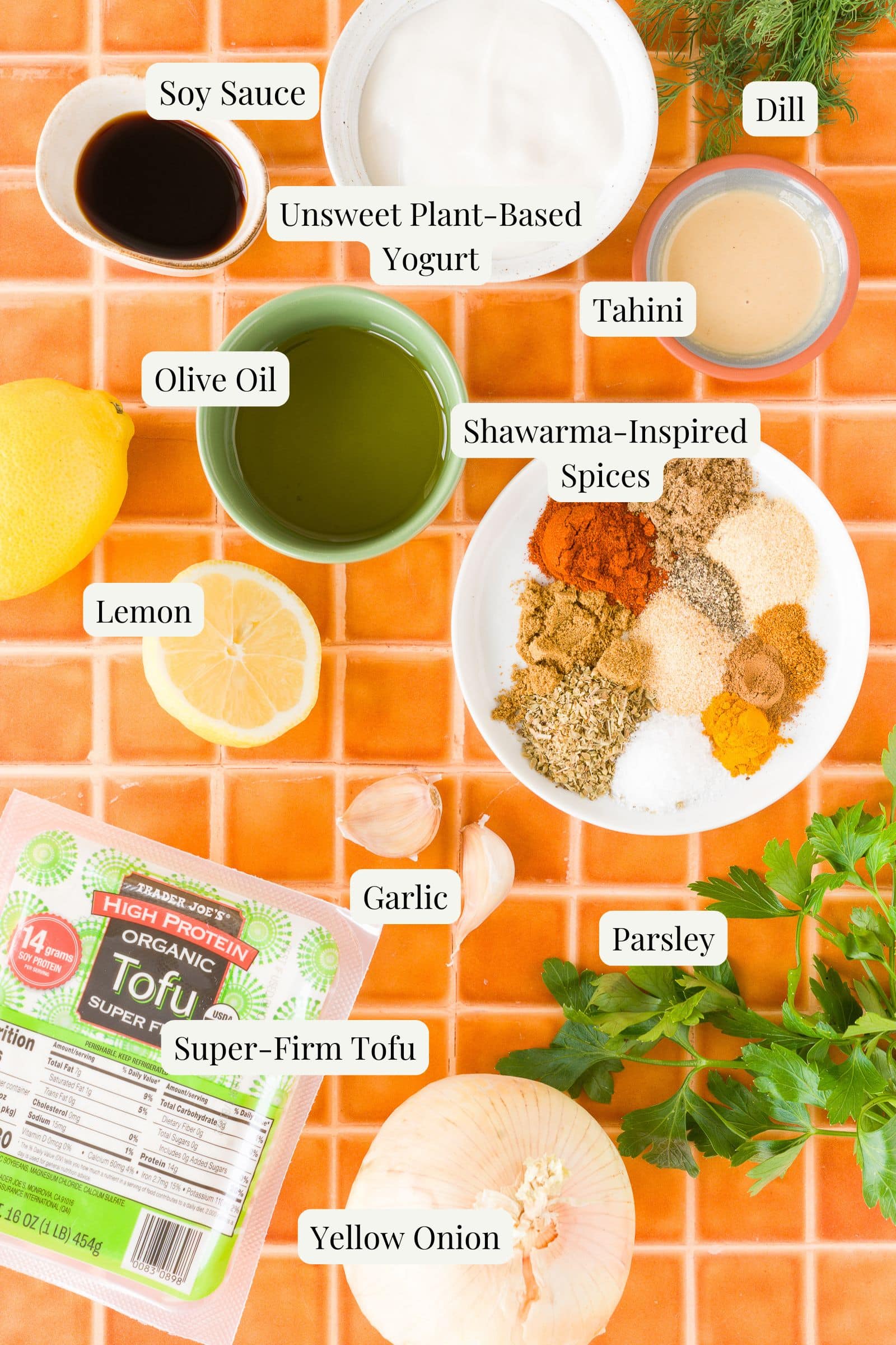 Labeled ingredients in small dishes and plates.
