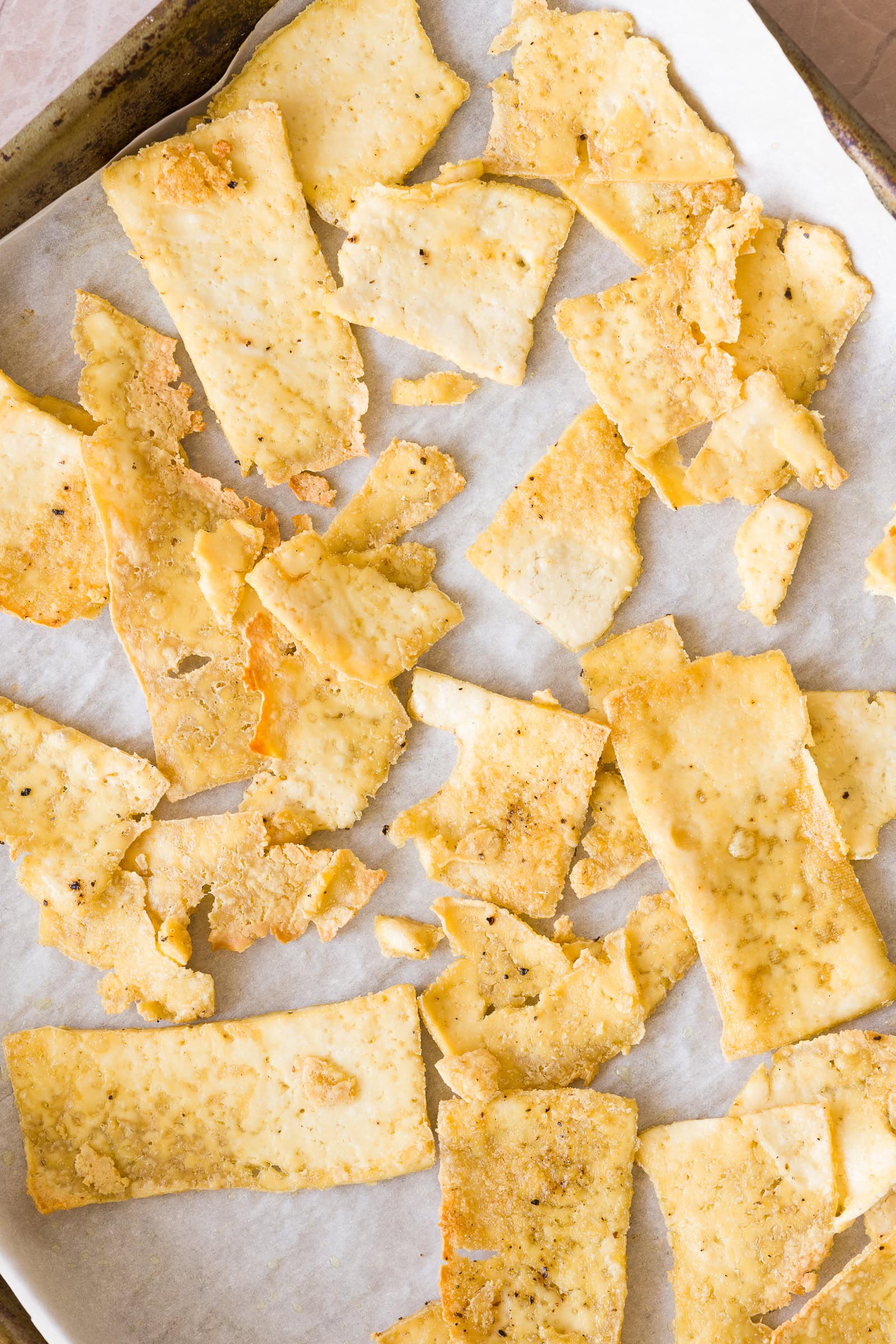 Crispy baked shaved tofu on a baking sheet.