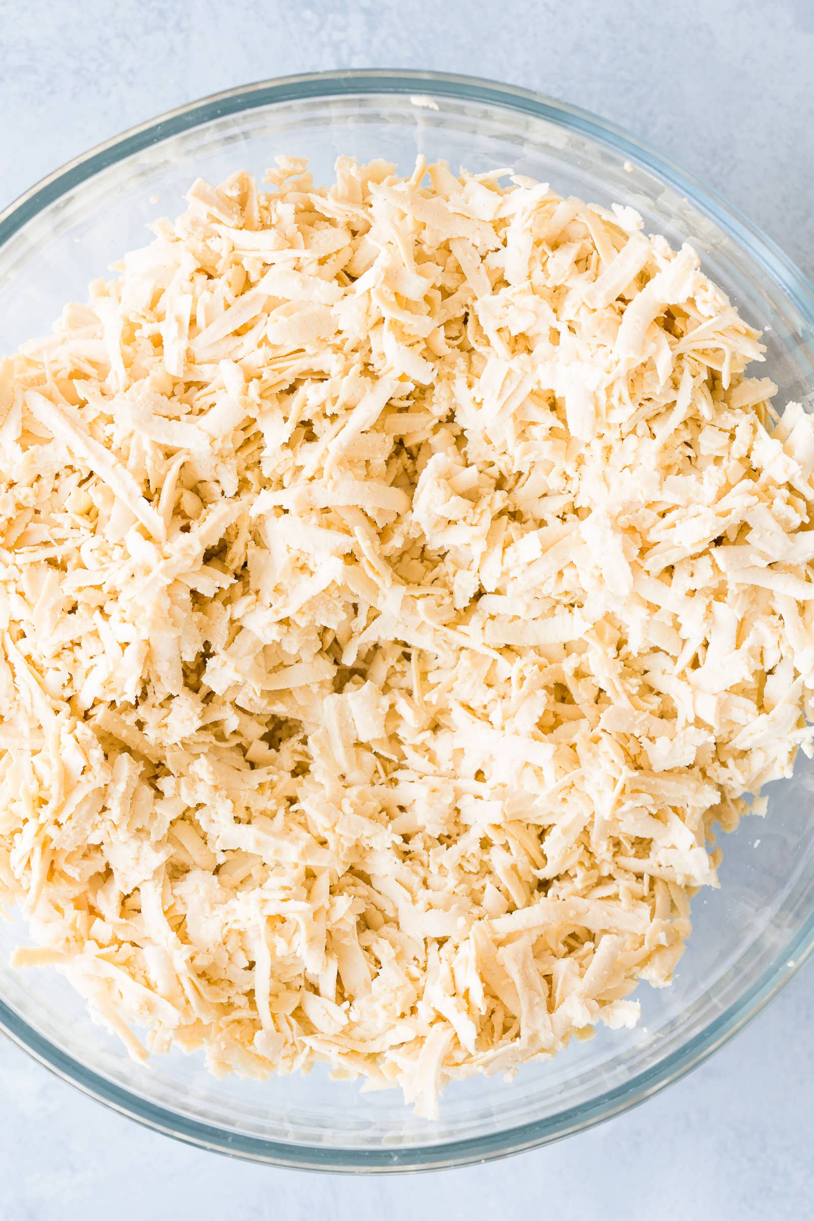 Shredded tofu in glass bowl.