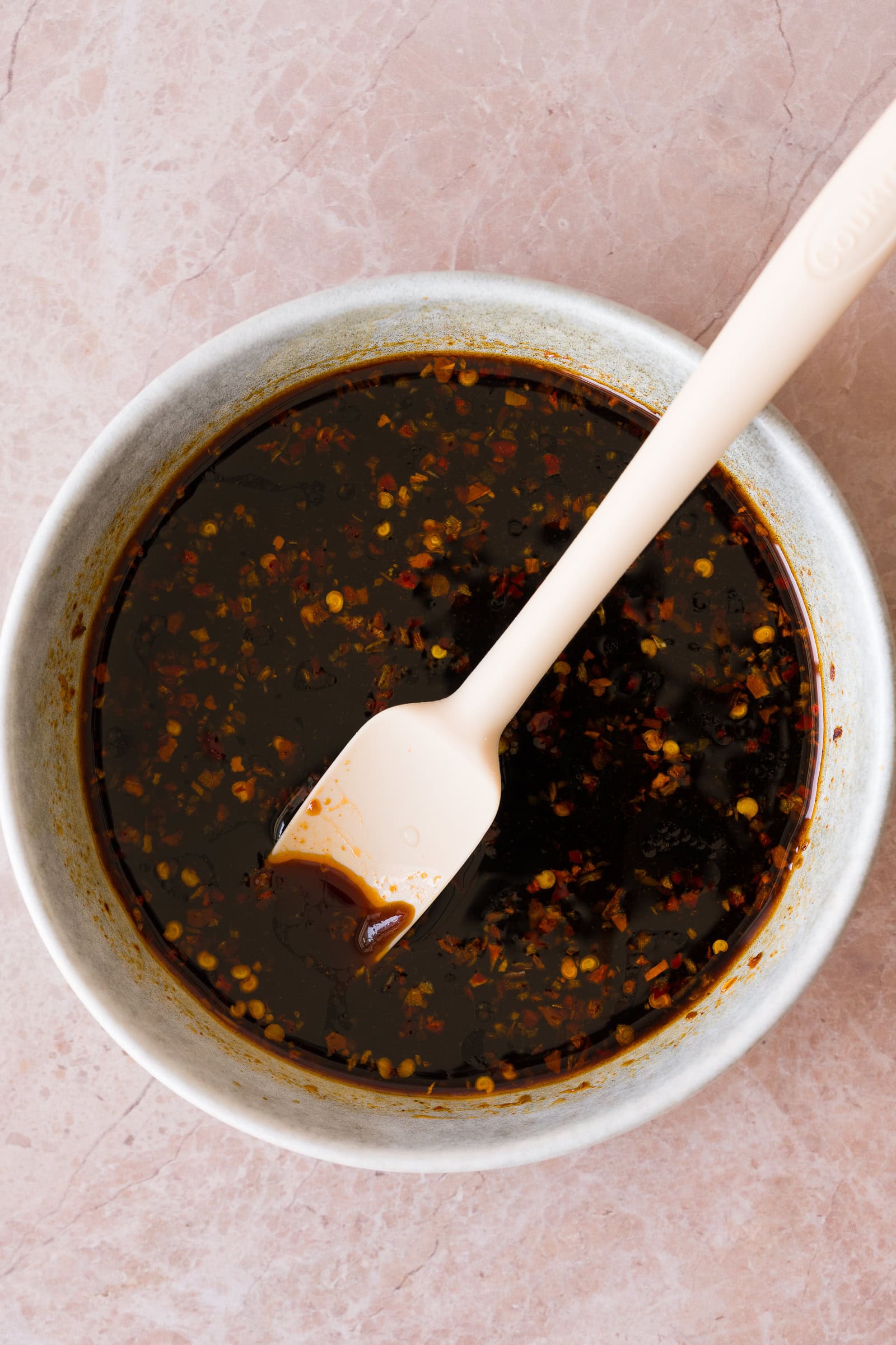 Sauce being mixed in a bowl.