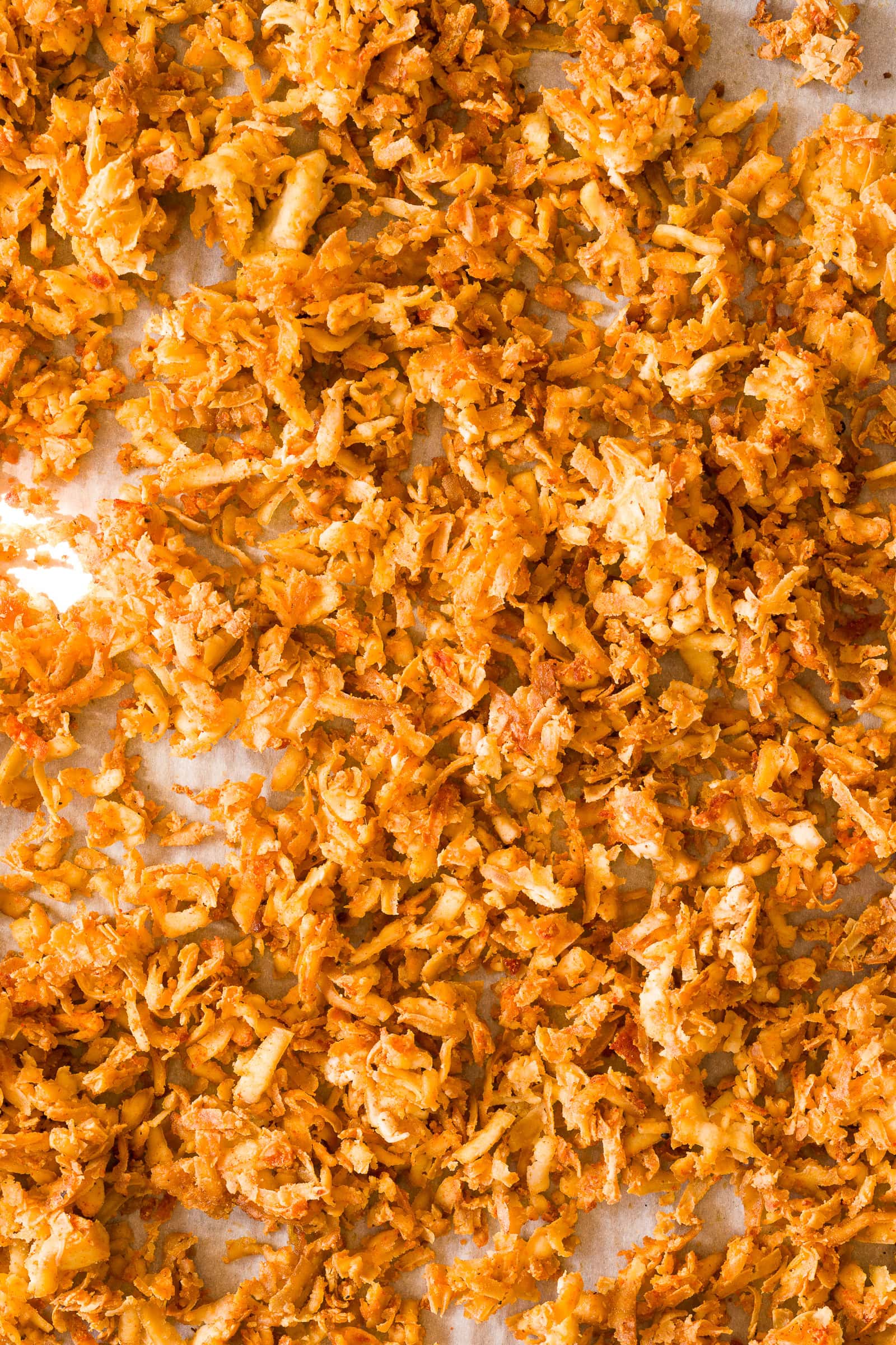 Crispy shredded tofu on baking sheet.